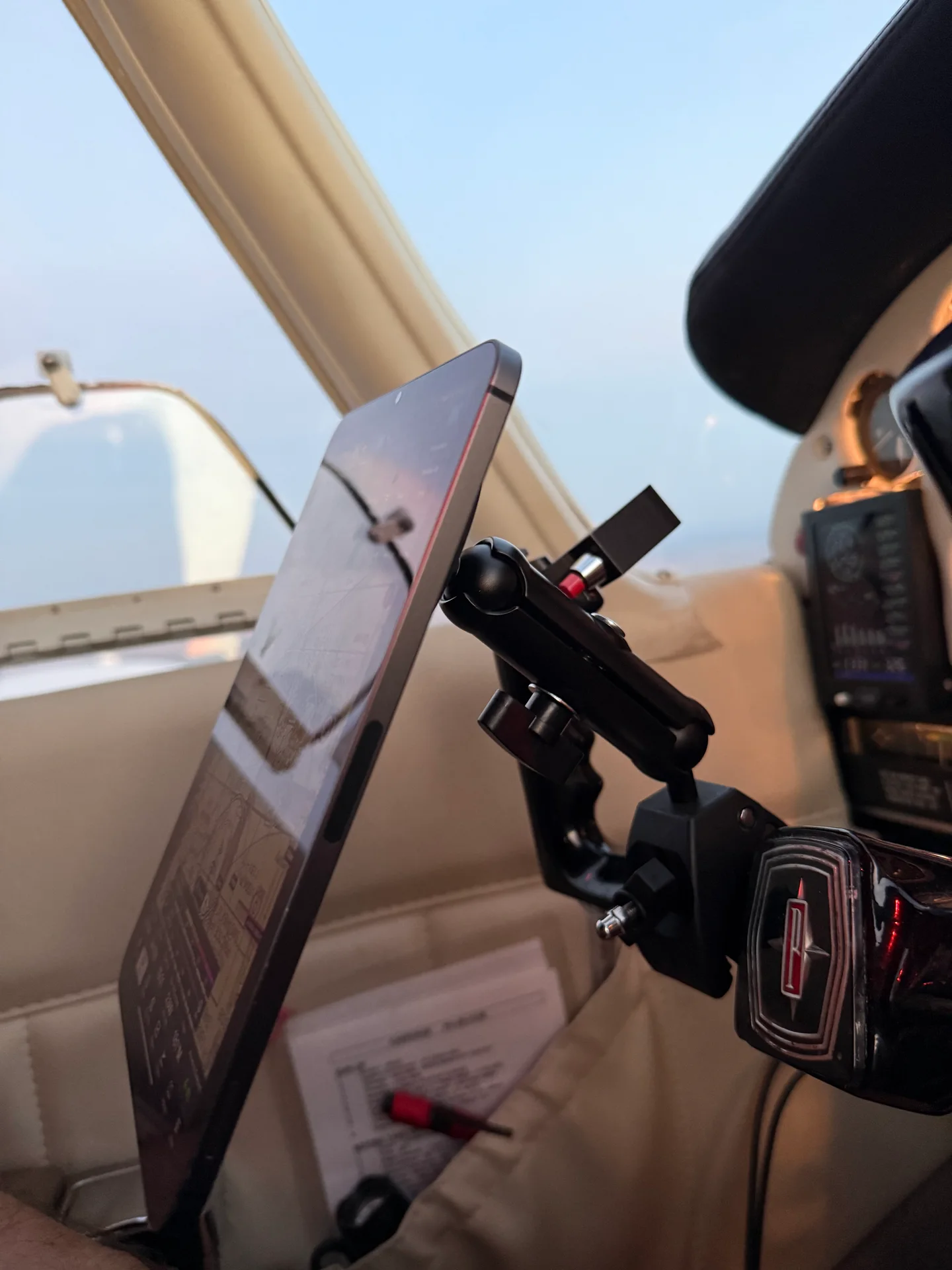 Side view of the FlightPro yoke mount showing the clamp, adjustable arm, and ball joint behind the iPad